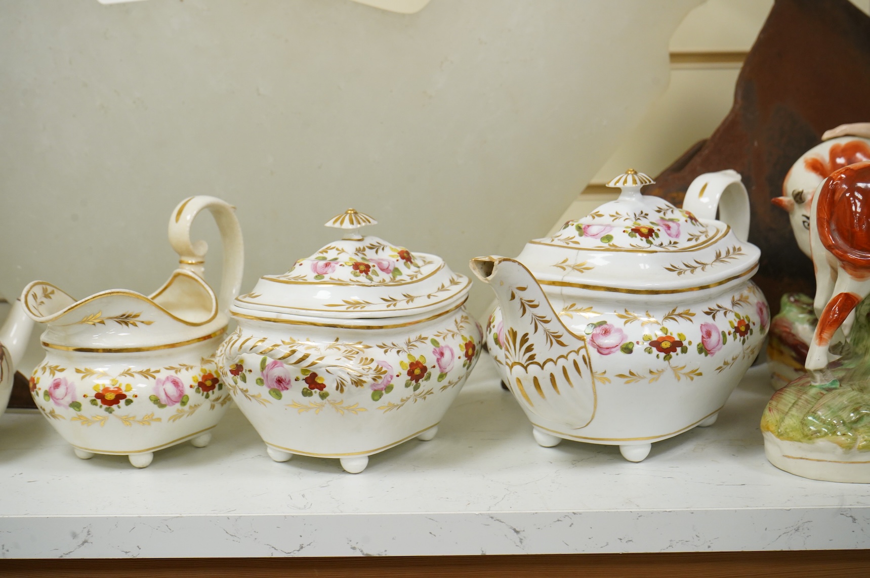 An early 19th century Derby three piece tea service, A pair of Staffordshire cow groups, Wedgwood etc